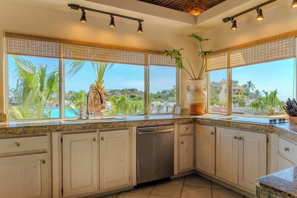 Fully equipped kitchen with large windows