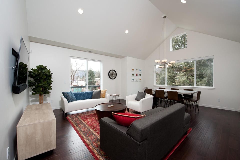 Living room with TV and dining area