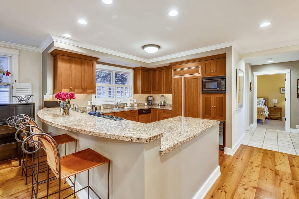 Kitchen - Open kitchen has state of the art appliances and wine cooler