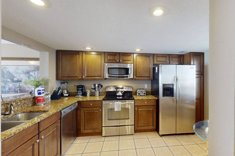 Fully equipped kitchen with granite countertops stainless steel appliances and small appliances for all your kitchen needs