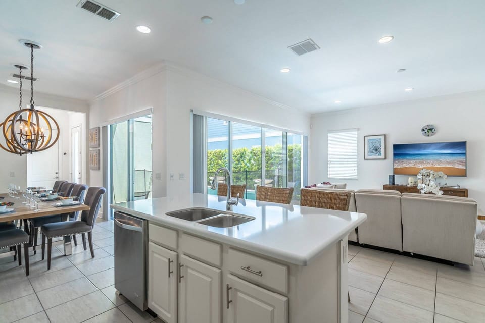 Bright and open Kitchen, Living and dining floor plan with access to the private pool and patio area