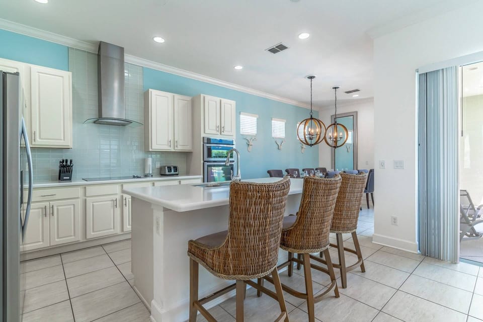 Fully stocked gourmet kitchen with bar seating for 3