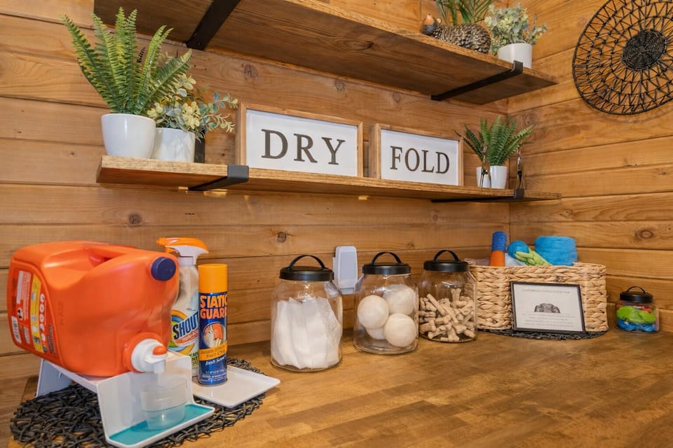 Your laundry needs are covered with this charming rustic station featuring eco-friendly supplies and thoughtful organization.