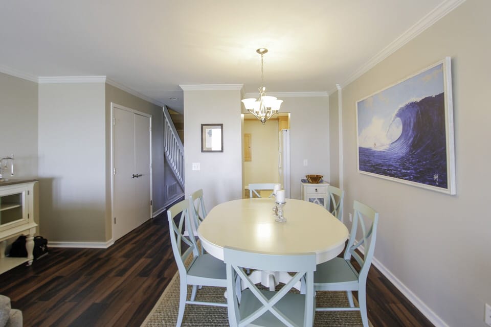Dining table seats 6, with additional seating for 4 on screened porch