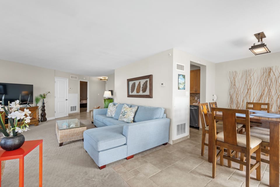 Relax in your spacious living area with comfortable seating, modern décor, and seamless flow to your dining space.