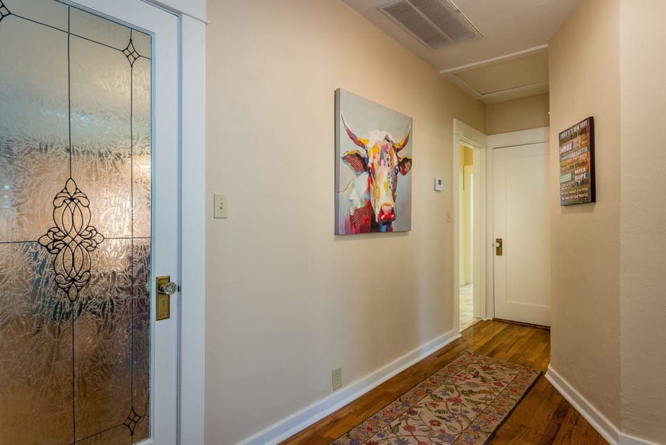 Main Hallway of the Home that connects all Bedrooms with Hardwoo