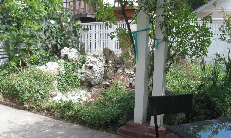 Step out to a shaded patio beside the garden
