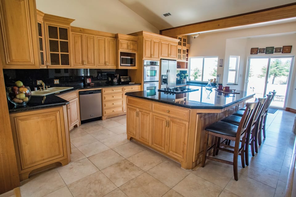 Bright chef's kitchen with ample prep space.