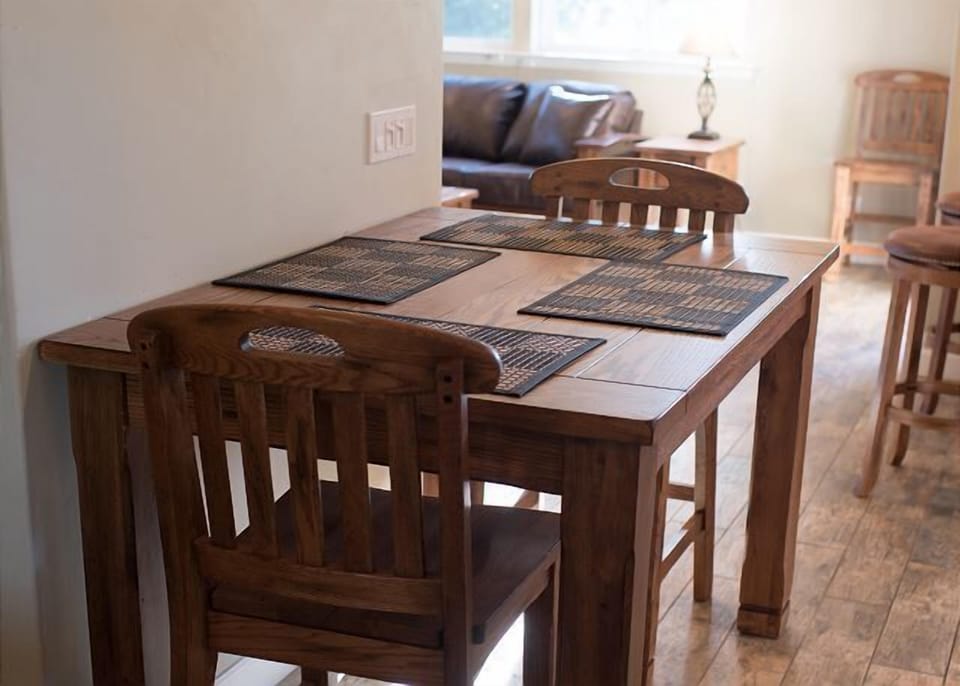 Gather around the wood table for easy shared meals
