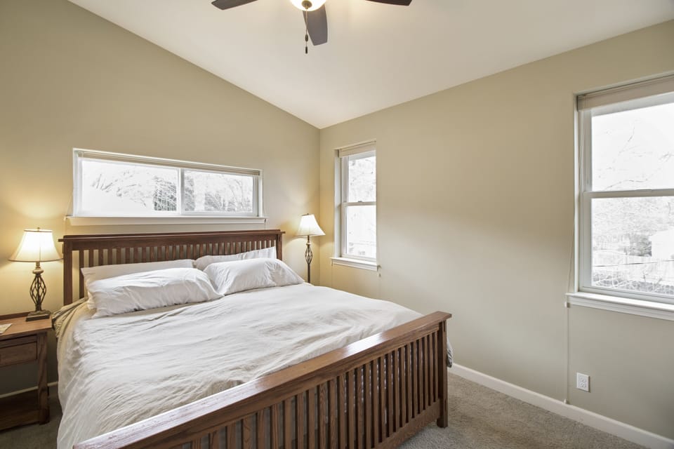 Rest easy in the king bed with soft light from every window