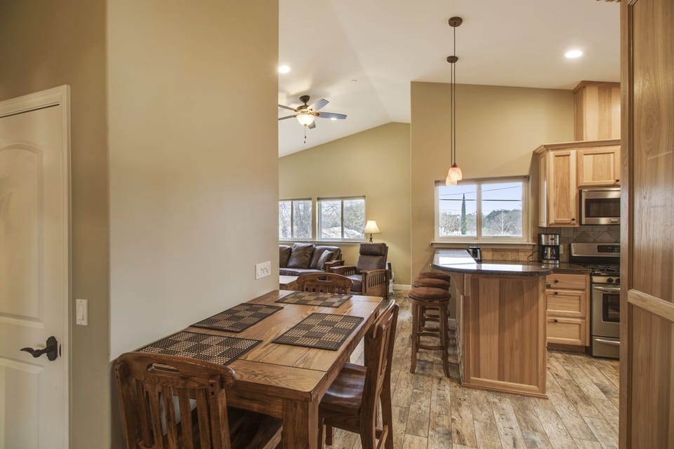 Gather around the dining table near the kitchen