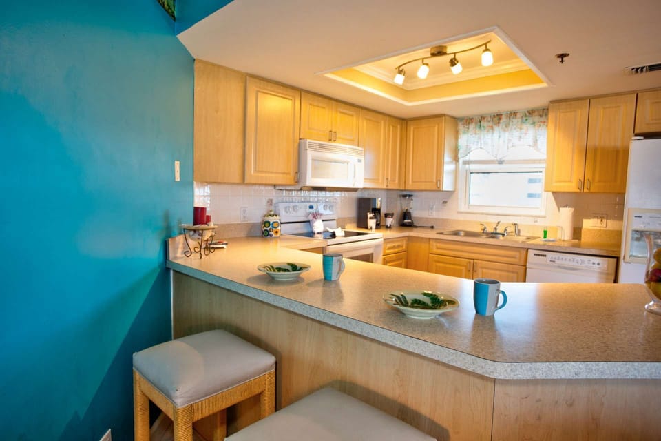 Bar stool seating at the kitchen counter.