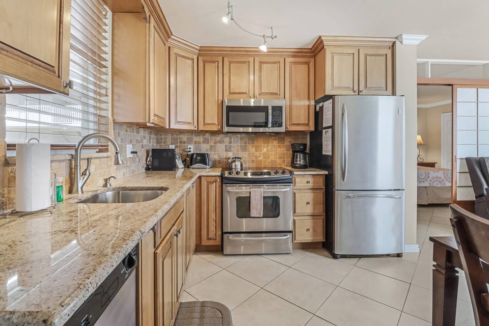 Beautiful, full kitchen, with stainless appliances, granite counters, upgraded cabinets, and all the cooking essentials.