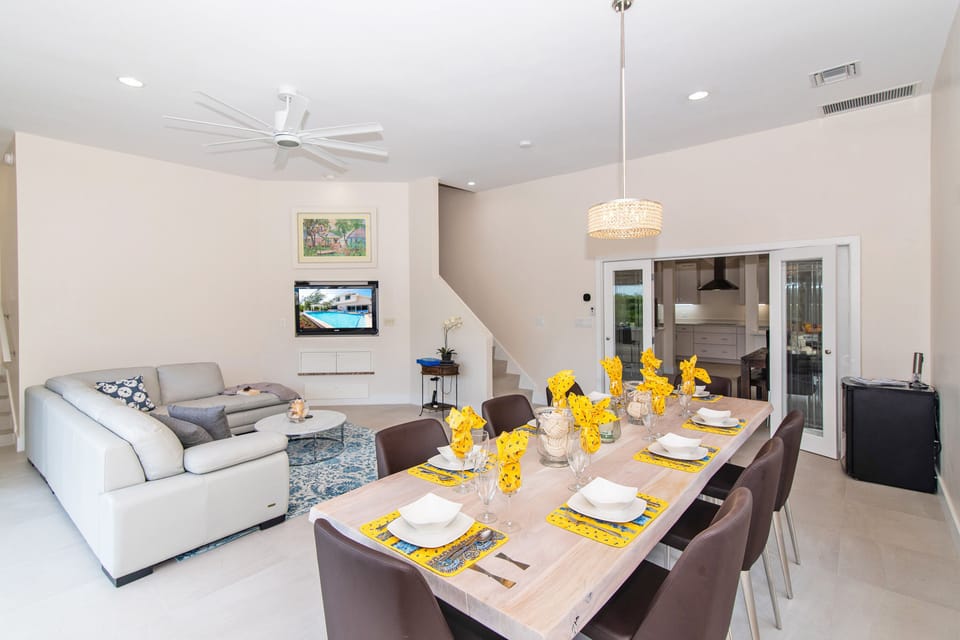 Formal dining area with seating for 8. A second dining area sit off the kitchen beyond the french doors. 