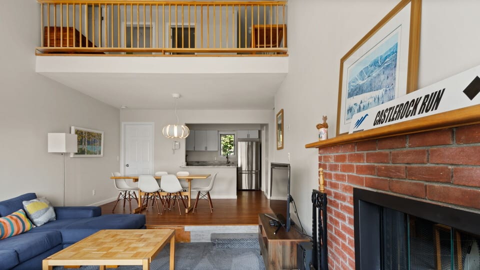 Open living Space with Fireplace, dining area and updated kitchen