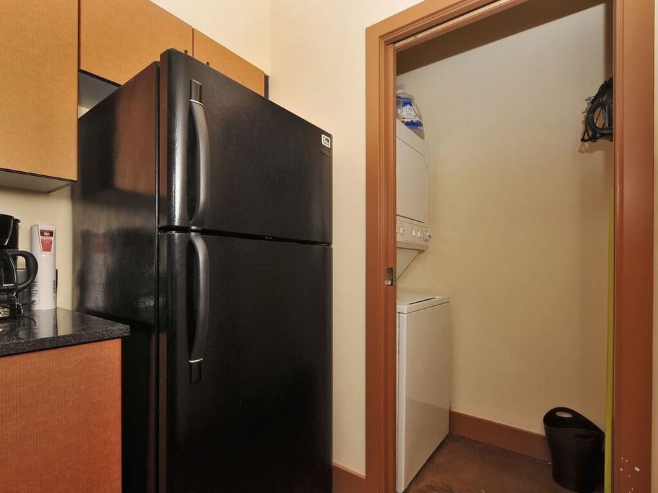 Travel light! Enjoy the ultimate convenience of a private, in-suite stacked washer and dryer tucked right off the kitchen.