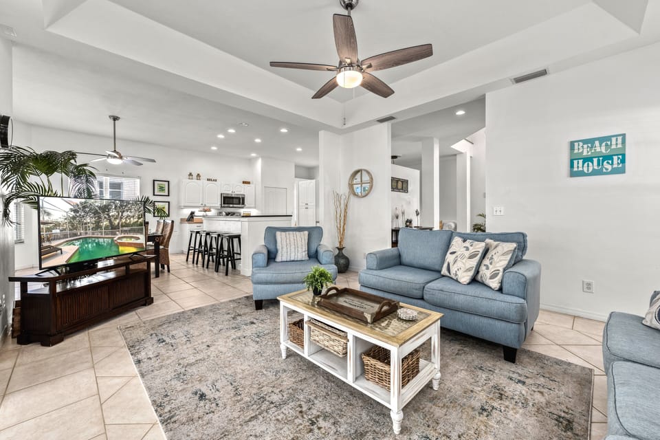 Feel the heartbeat of the home where living, dining, and cooking blend seamlessly into one bright, welcoming space made for connection and celebration.