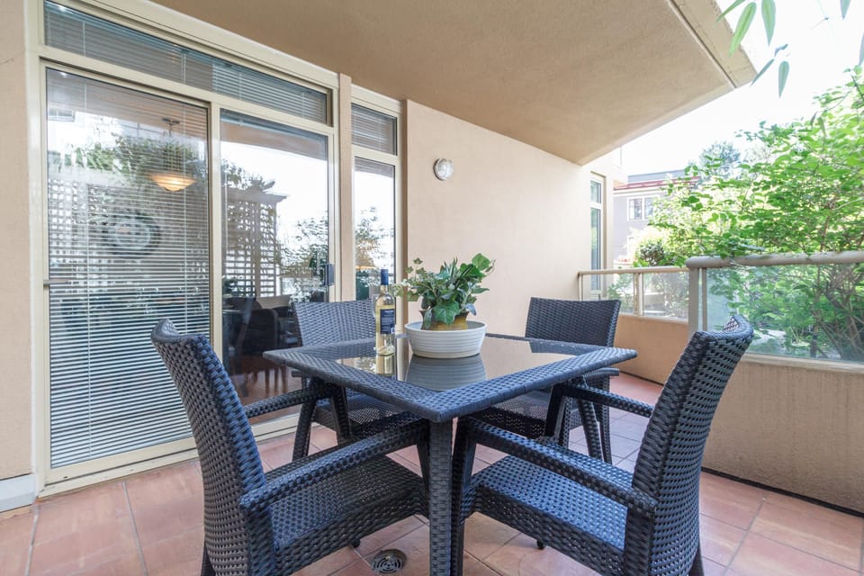 Sip your morning coffee on the spacious covered balcony terrace, equipped with a outdoor dining table set.