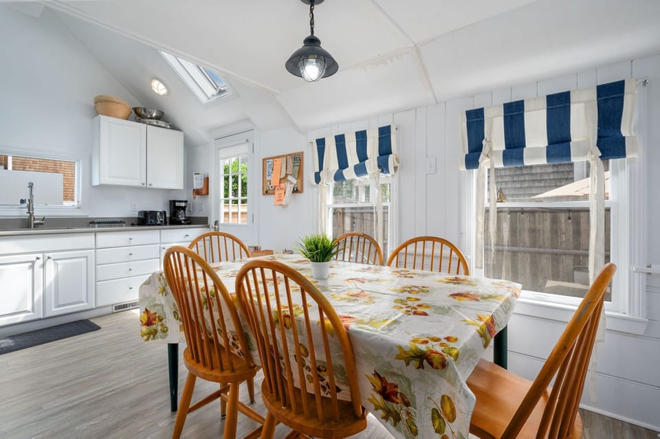 Dining table conveniently shares space with the kitchen and offers seating for six-17 Ocean Ave Harwich Port Cape Cod-Kare Not-NEVR
