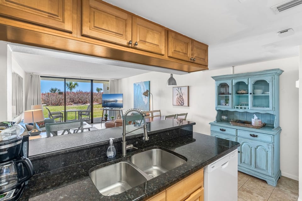 Kitchen sink with view of the patio and living room