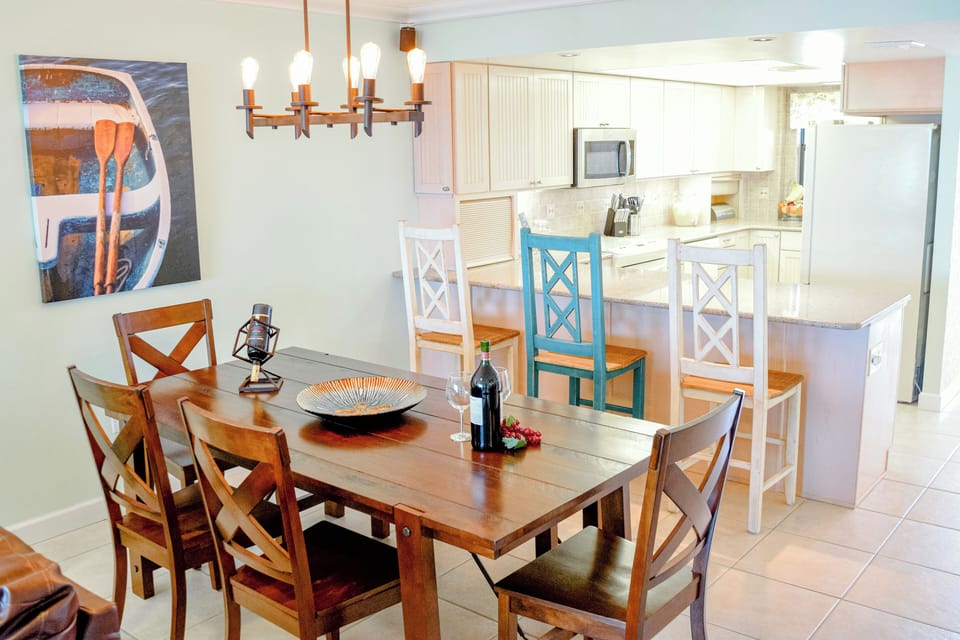 Plenty of seating for the whole family and guests dining table seats four and breakfast bar seats three