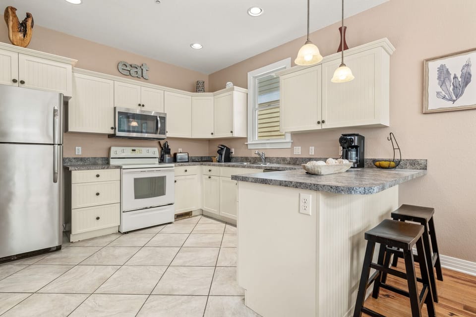 Kitchen with Bar Seating on First Level