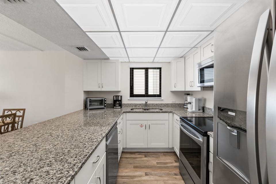 Kitchen - This unit features stainless steel appliances & lots of cabinet and counter space