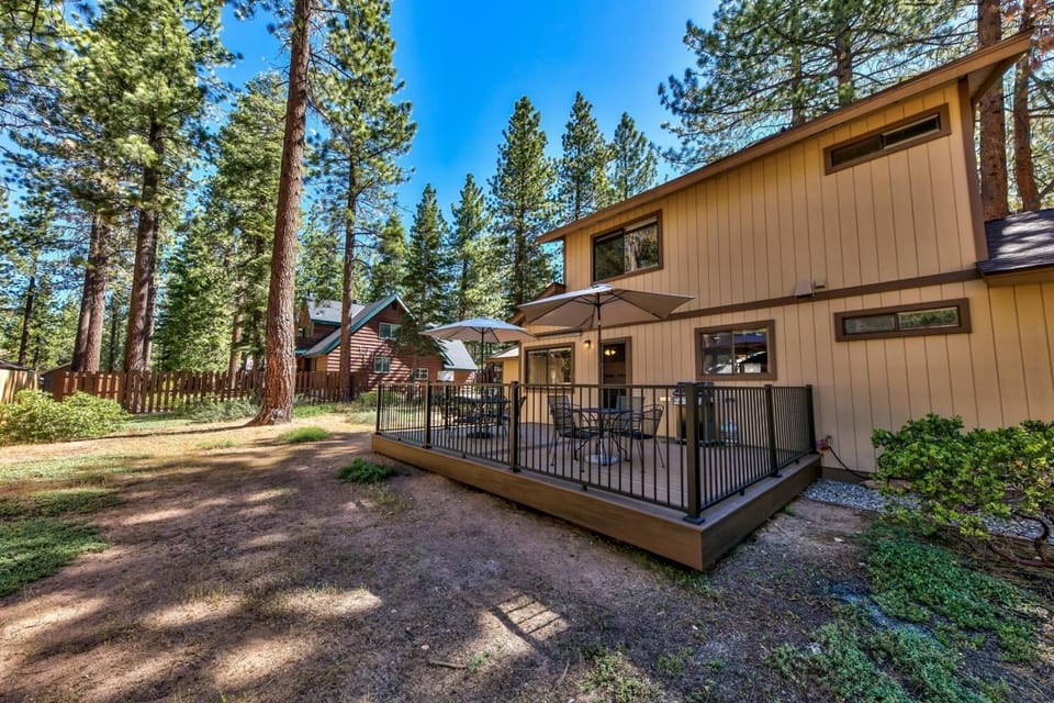 Your private forest retreat features a spacious deck where you can dine al fresco under towering pines, breathing in the crisp mountain air.