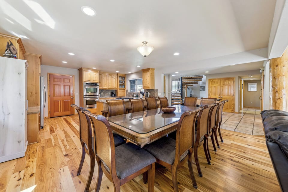 Bright dining area with seating for ten and beautiful waterfront views
