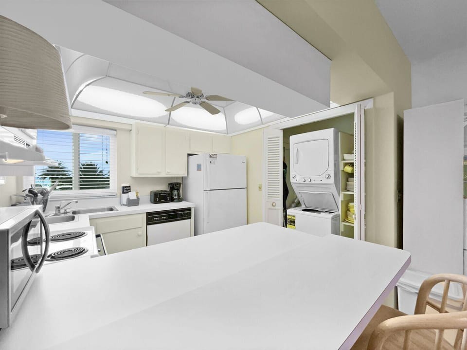 Wide-angle kitchen view showing full counter space and appliances