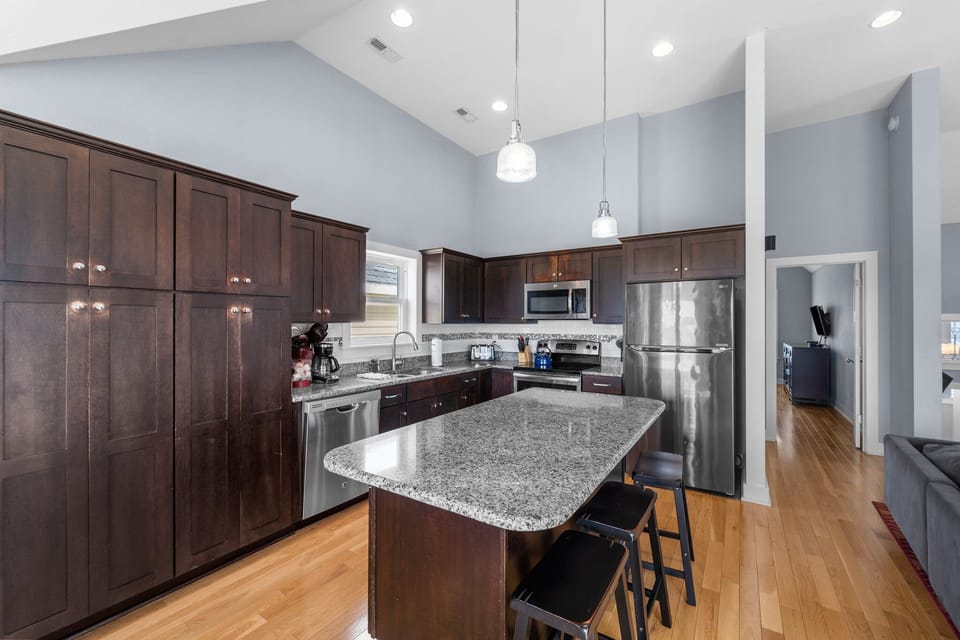 Kitchen with Bar Seating on Third Level