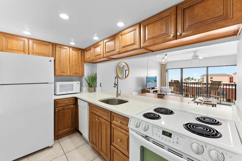 Classic kitchen with warm wooden cabinetry and everything you need to cook