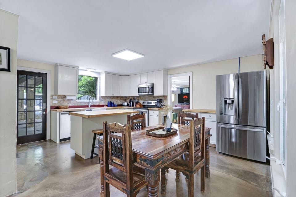 Off the kitchen, is the door to bedroom one