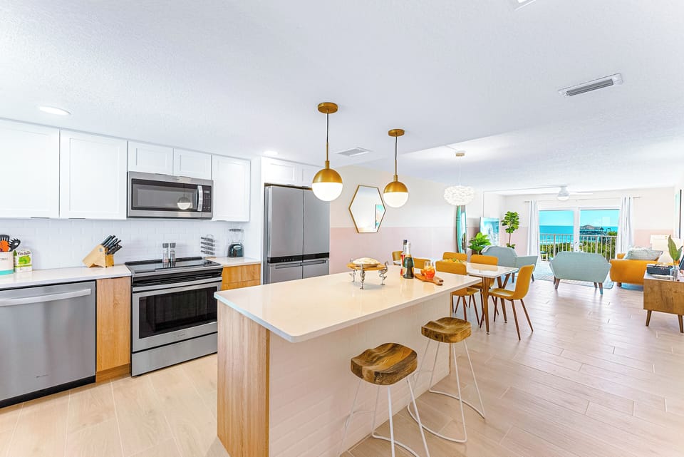 A beautifully upgraded kitchen and dining space with modern amenities and style