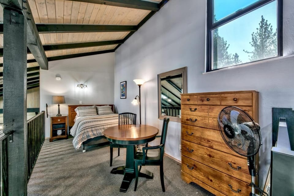 Upstairs loft with full bed, shares mid-level bathroom