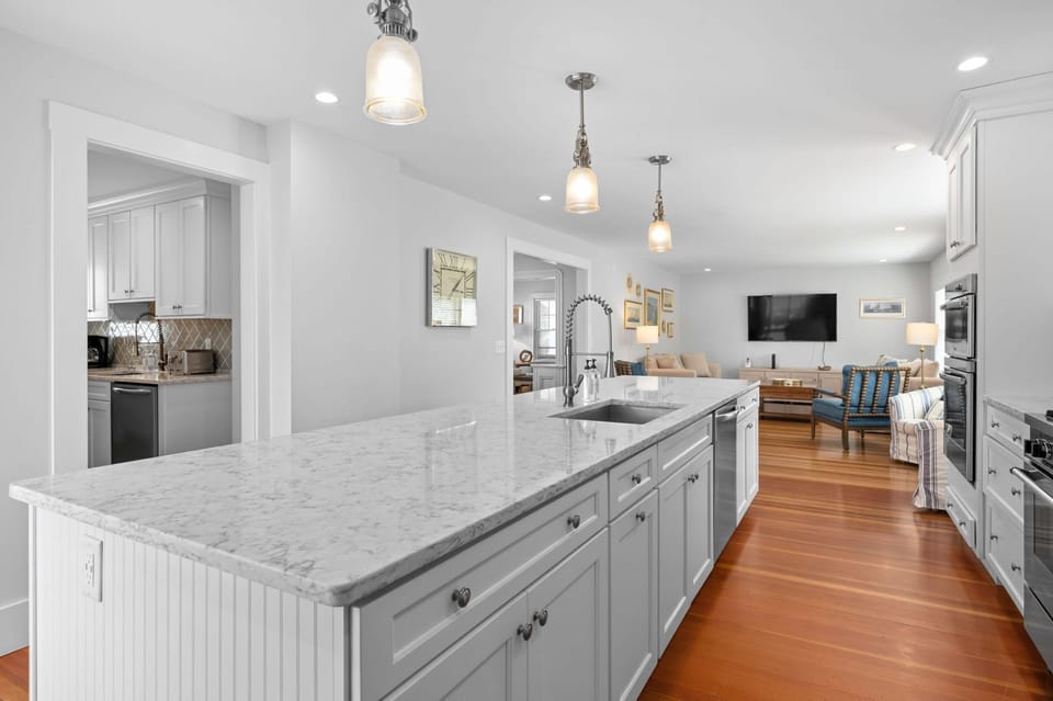 View from the kitchen to the pantry, family room and dining area in the adjoining room - 388 Main Street Chatham Cape Cod - The Priscilla House