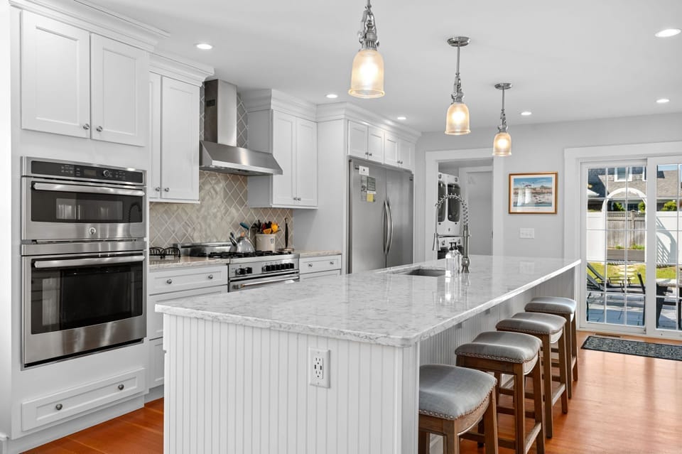 Seating for four at the marble countertop island! - 388 Main Street Chatham Cape Cod - The Priscilla House