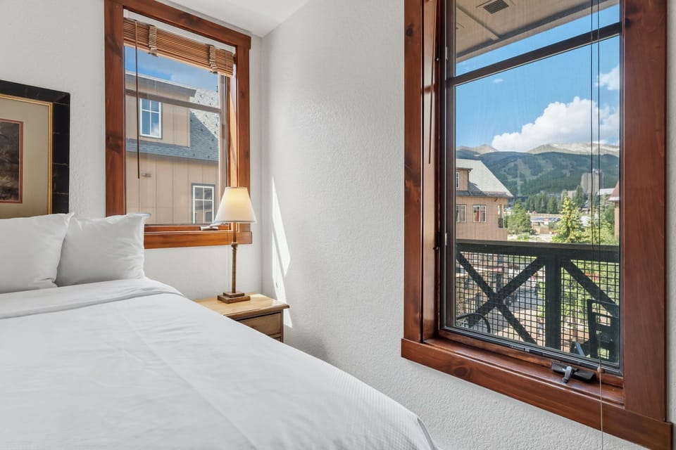 Wake up to stunning mountain views framing your private retreat. Crisp linens and warm wood accents create a peaceful sanctuary where you'll love starting your day.