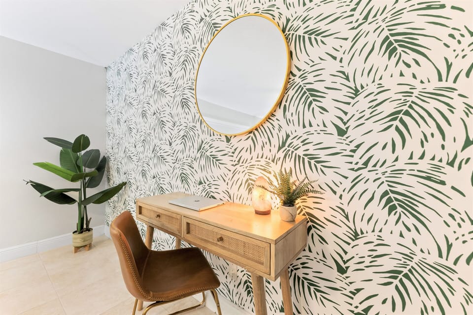 A cozy workspace in the master bedroom, perfect for remote work needs.