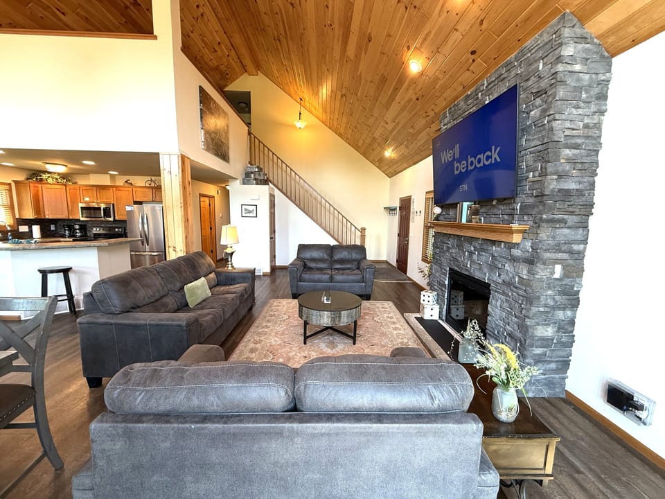Living Room with Cozy Seating, Queen Sofa Sleeper, TV & Fireplace