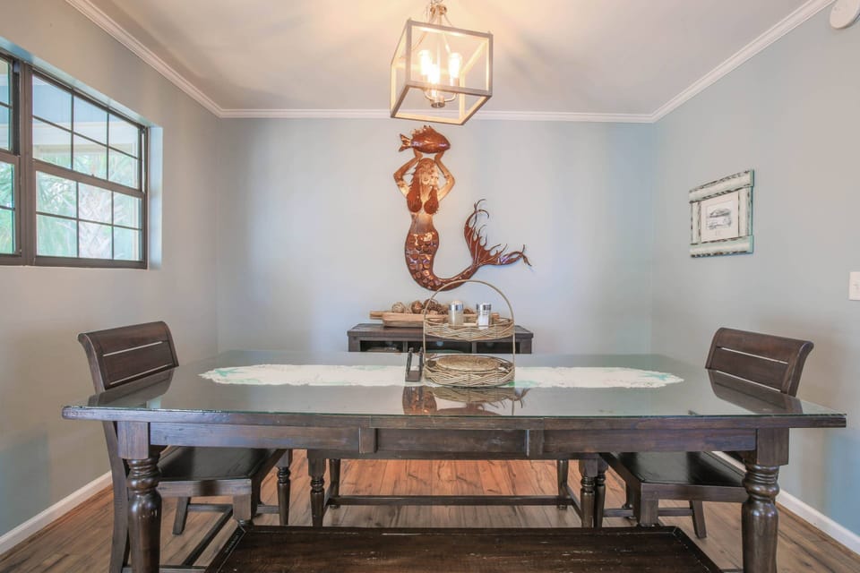 The dining room table comfortably fits 8 people.