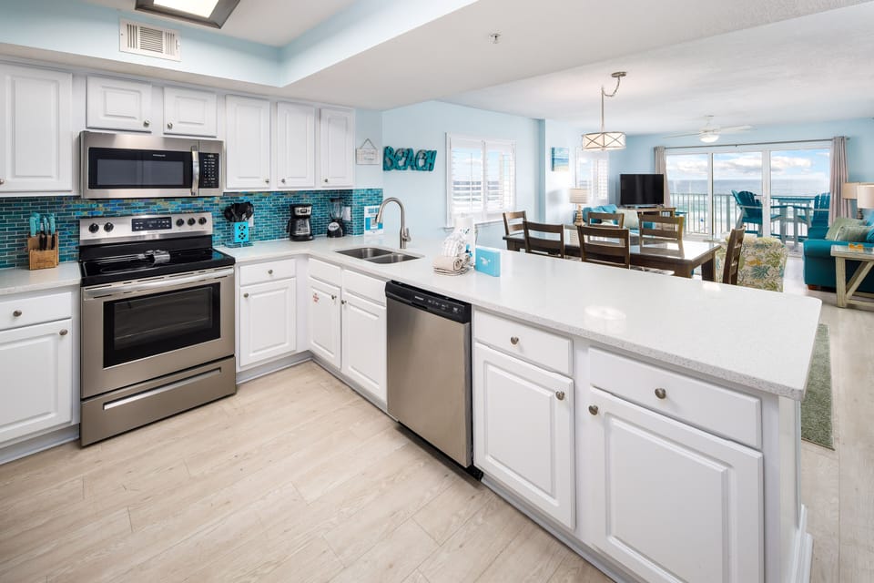 KITCHEN COUNTERS! Lowered and leveled for better VIEWS - Large kitchen with lots of counter space, cabinets and all major appliances. Cookware and utensils all included.