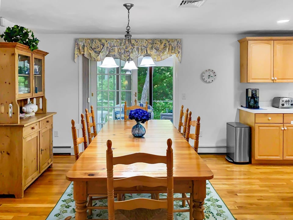 Dining area off of the kitchen offers easy access to screened in porch