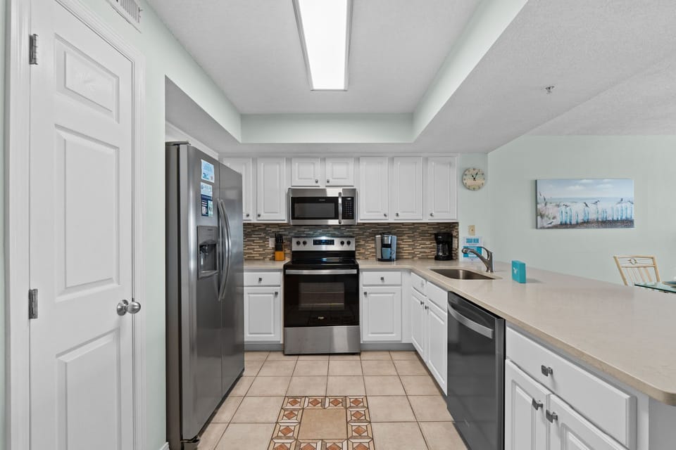 Kitchen - Enjoy cooking in this fully stocked kitchen while enjoying the view