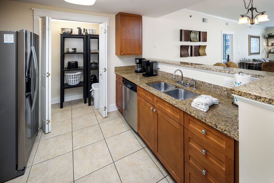 Kitchen - Featuring stainless steel appliances, granite counter tops and ample storage space