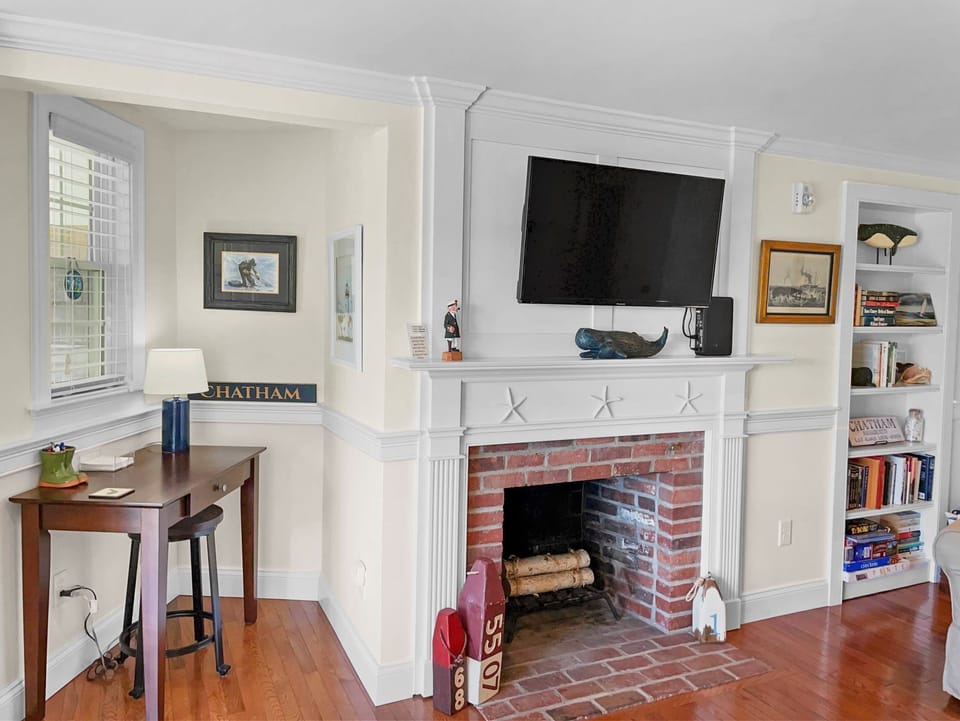 Take a moment to reconnect and answer emails from this work nook next to the fireplace  - 109 Misty Meadow Lane #1 Chatham Cape Cod New England Vacation Rentals
