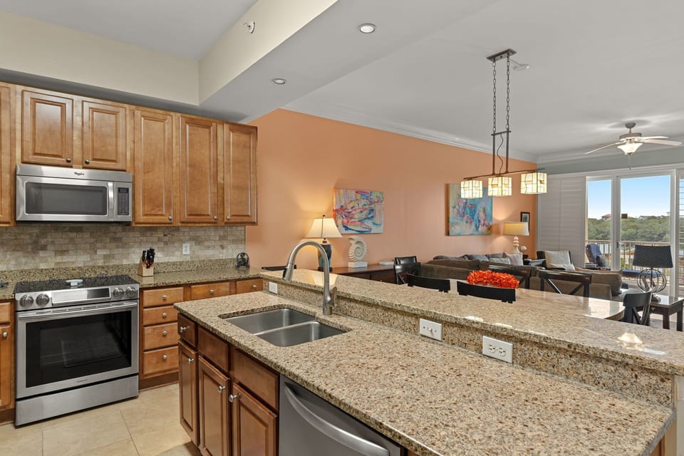Picture yourself preparing meals on granite counters in the fully-equipped kitchen, then relaxing in the open living area with windows framing lush views.