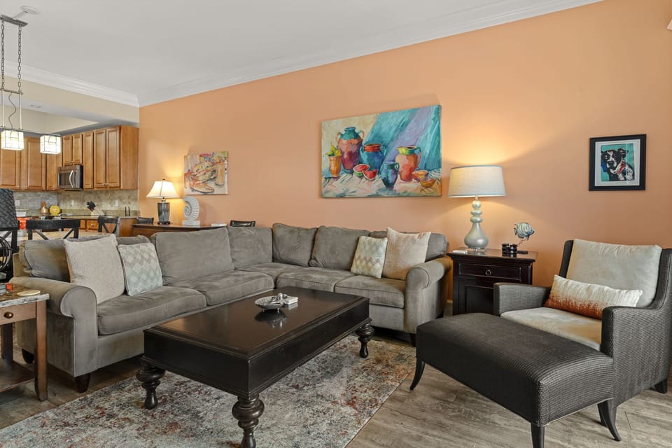 Open-concept living space, where warm tones and curated artwork create a relaxing retreat after your beach or lake adventures.