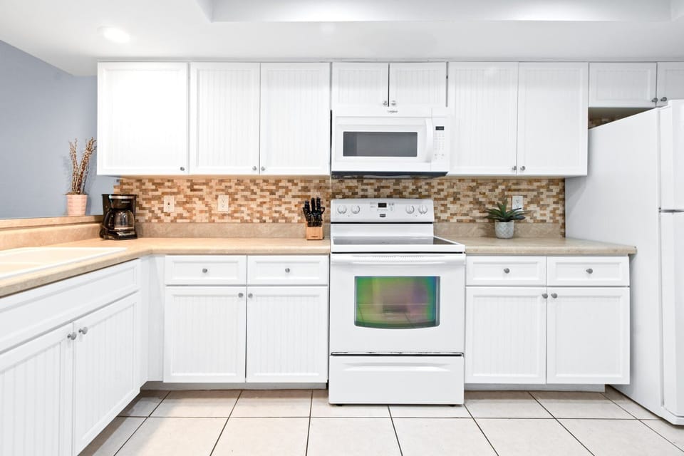 Spacious kitchen countertop and open layout leading to the dining area.