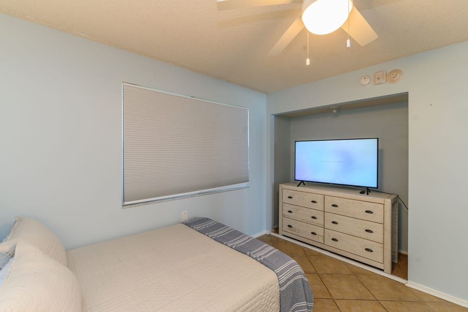 Peaceful and inviting guest room with TV